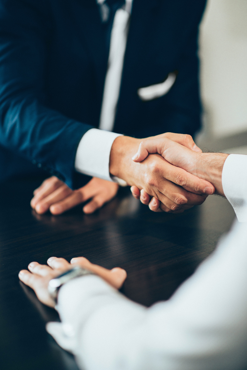 Business people shaking hands.